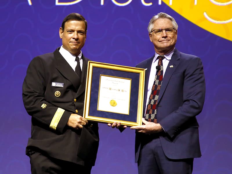 Ricks, left, in October 2021 received the Distinguished Service Award from the Board of Trustees of the American Dental Association. He’s pictured with ADA President Daniel Klemmedson.